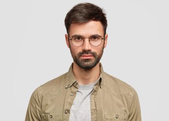 handsome-unshaven-european-man-has-serious-self-confident-expression-wears-glasses-min-min-scaled.jpg